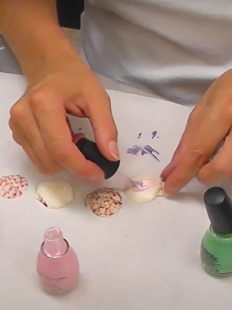 Paining a seashell pale pink for the summer hair accessories